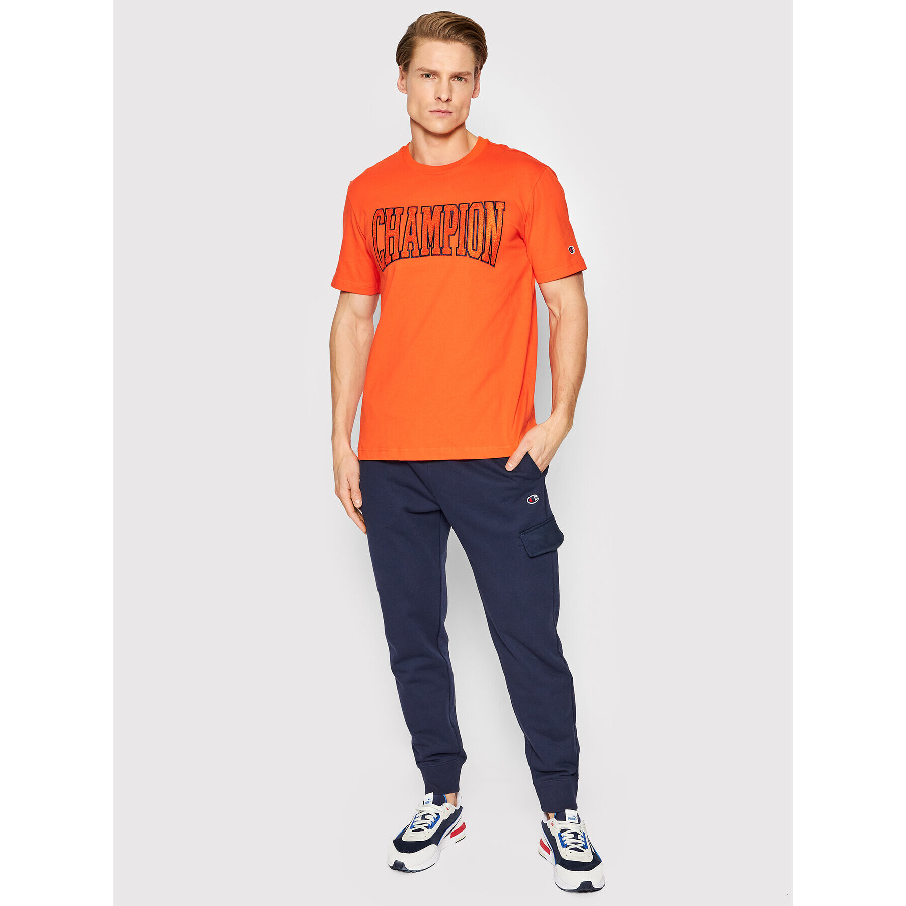 Champion Pantaloni trening Embroidered С Logo 217074 Bleumarin Regular Fit - Pled.ro