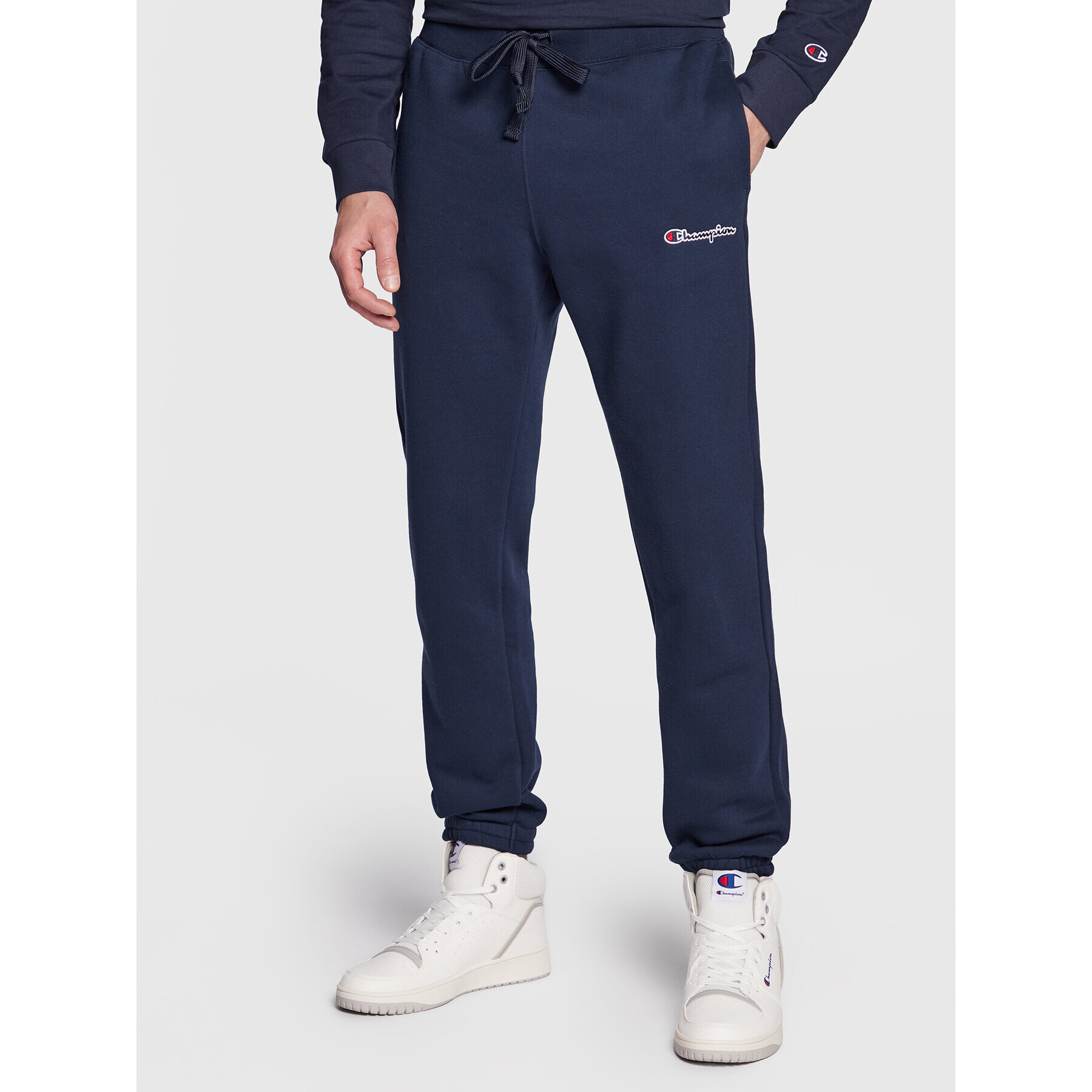 Champion Pantaloni trening Small Embroidery Script 218294 Bleumarin Regular Fit - Pled.ro