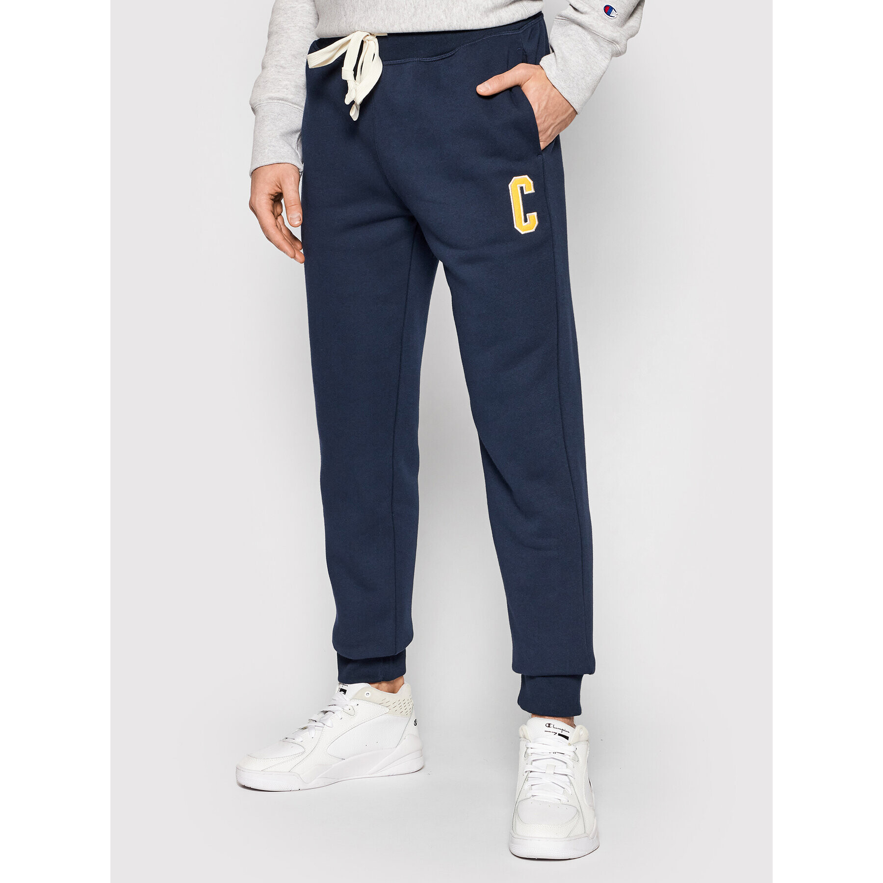 Champion Pantaloni trening Univercity 216573 Bleumarin Regular Fit - Pled.ro