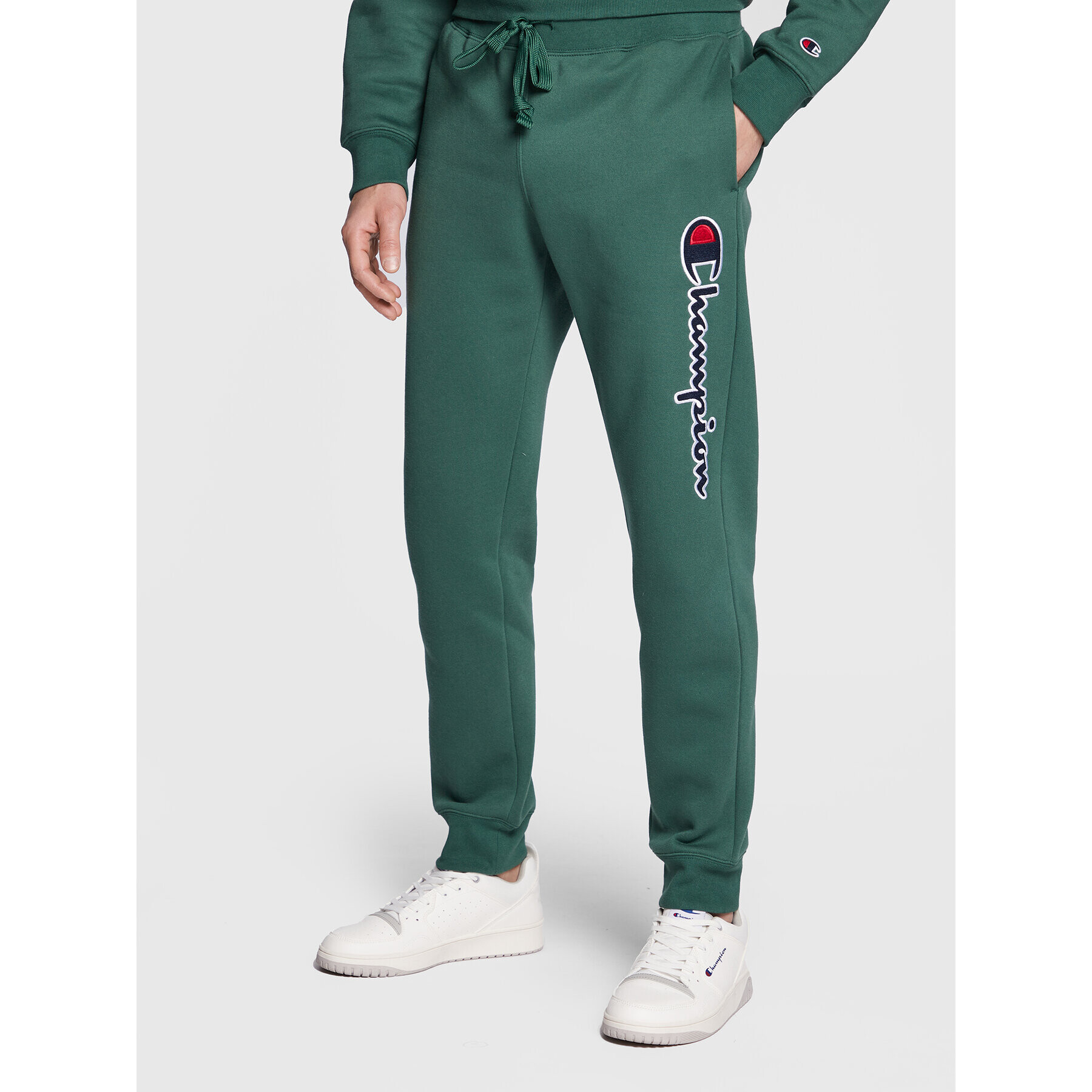 Champion Pantaloni trening Vertical Logo Embroidery 217860 Verde Regular Fit - Pled.ro