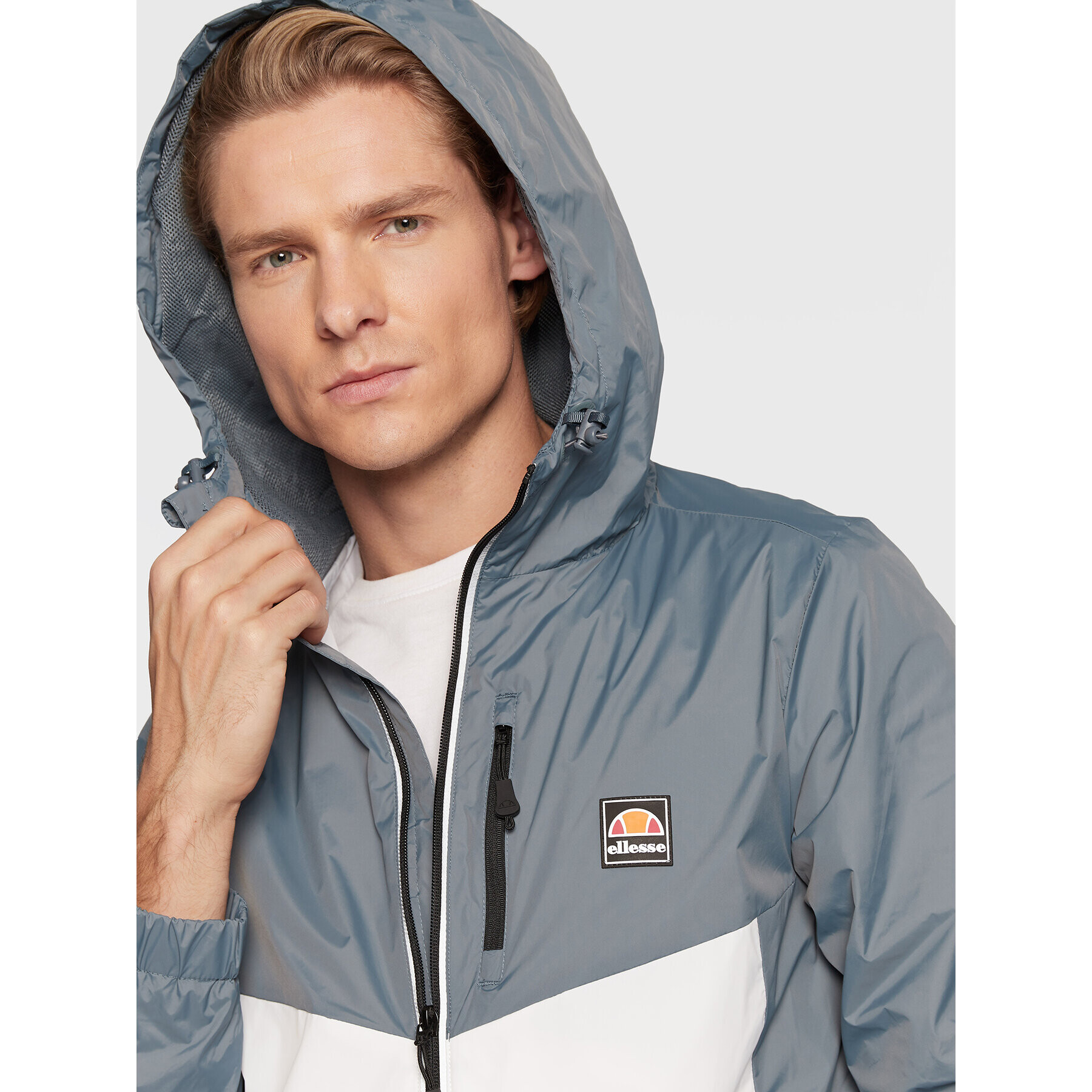 Ellesse Geacă de vânt Fraction SHP15815 Albastru Regular Fit - Pled.ro