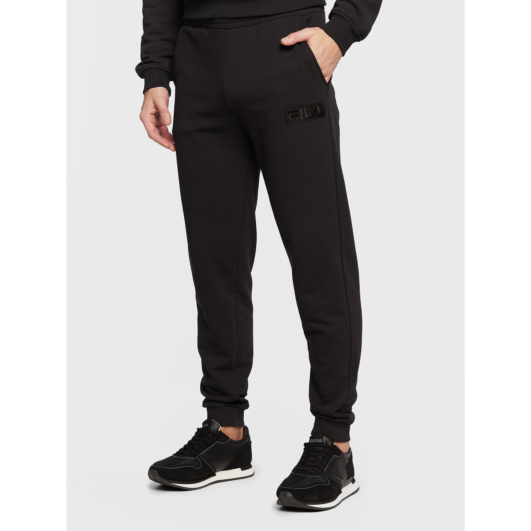 Fila Pantaloni trening Baska FAM0160 Negru Regular Fit - Pled.ro