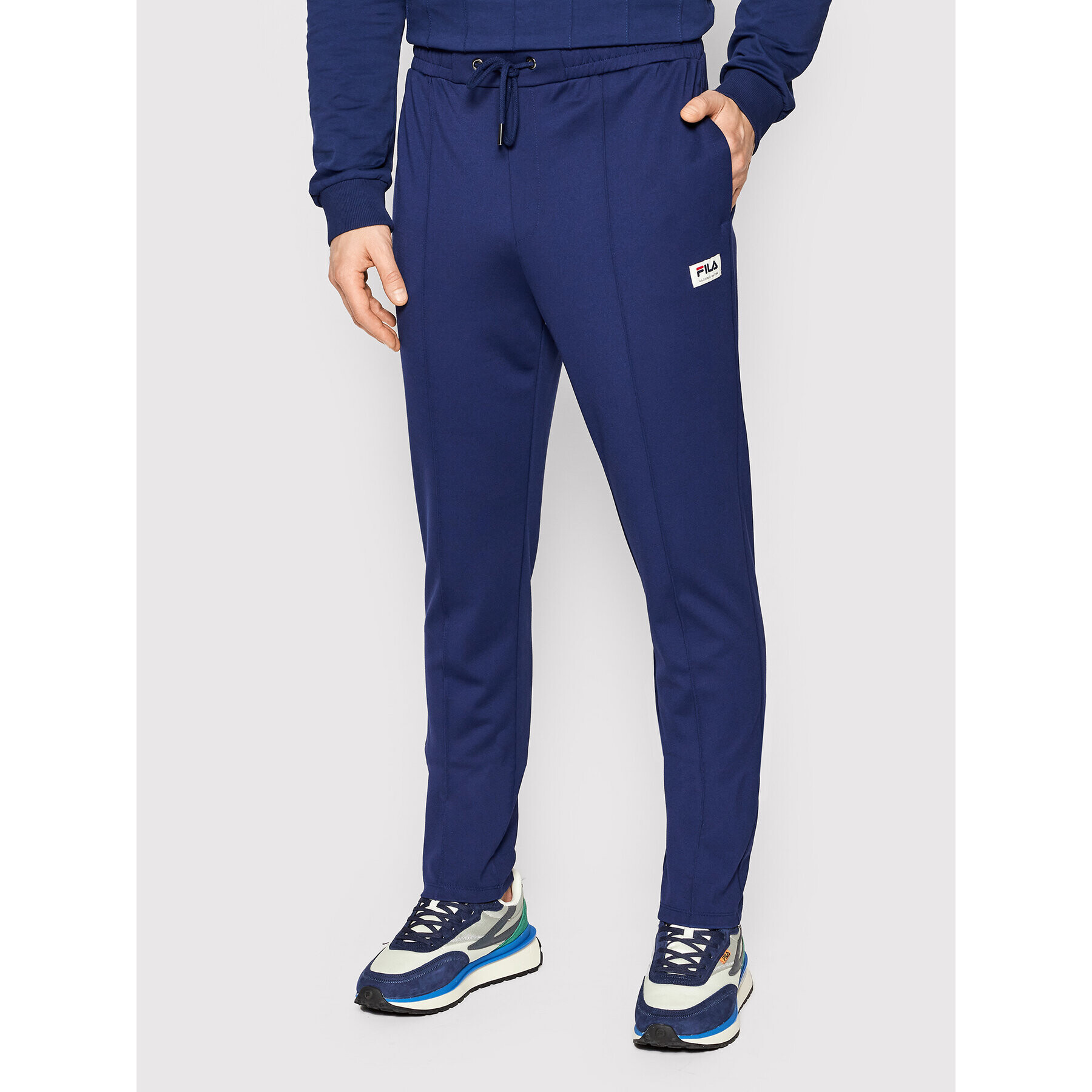 Fila Pantaloni trening Tatvan FAM0037 Bleumarin Regular Fit - Pled.ro