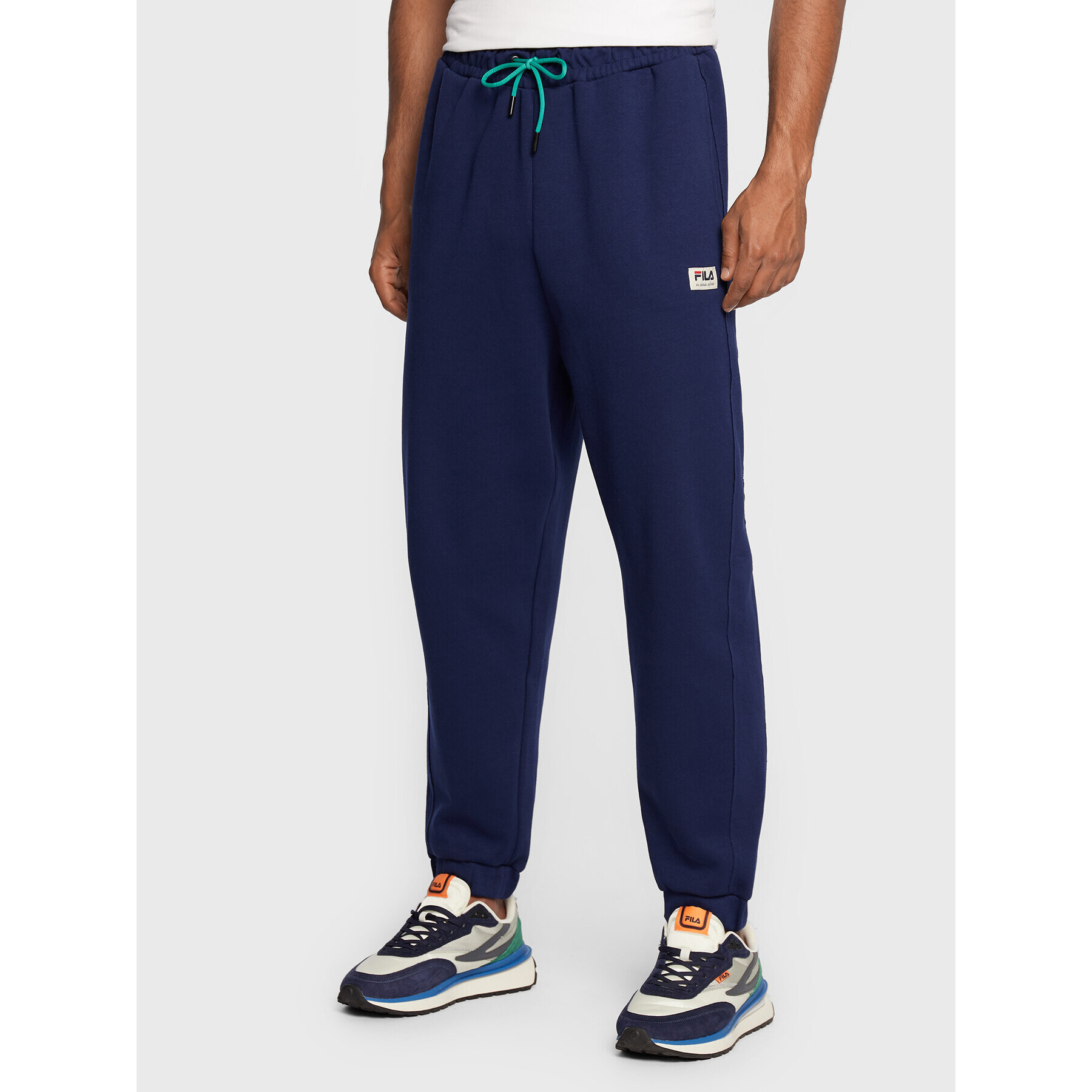 Fila Pantaloni trening Tricase FAM0153 Bleumarin Oversize - Pled.ro