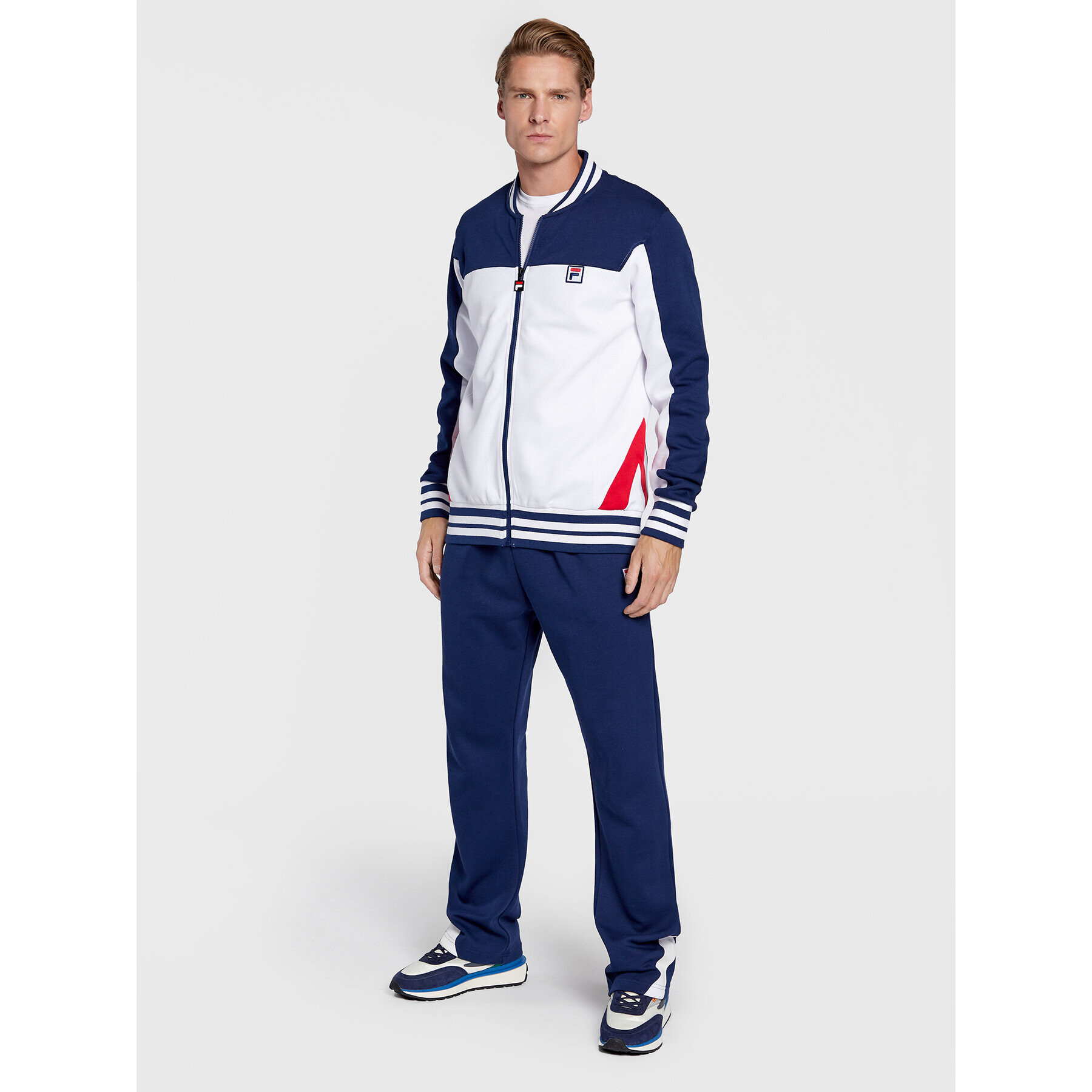 Fila Pantaloni trening Zigong FAM0169 Bleumarin Regular Fit - Pled.ro