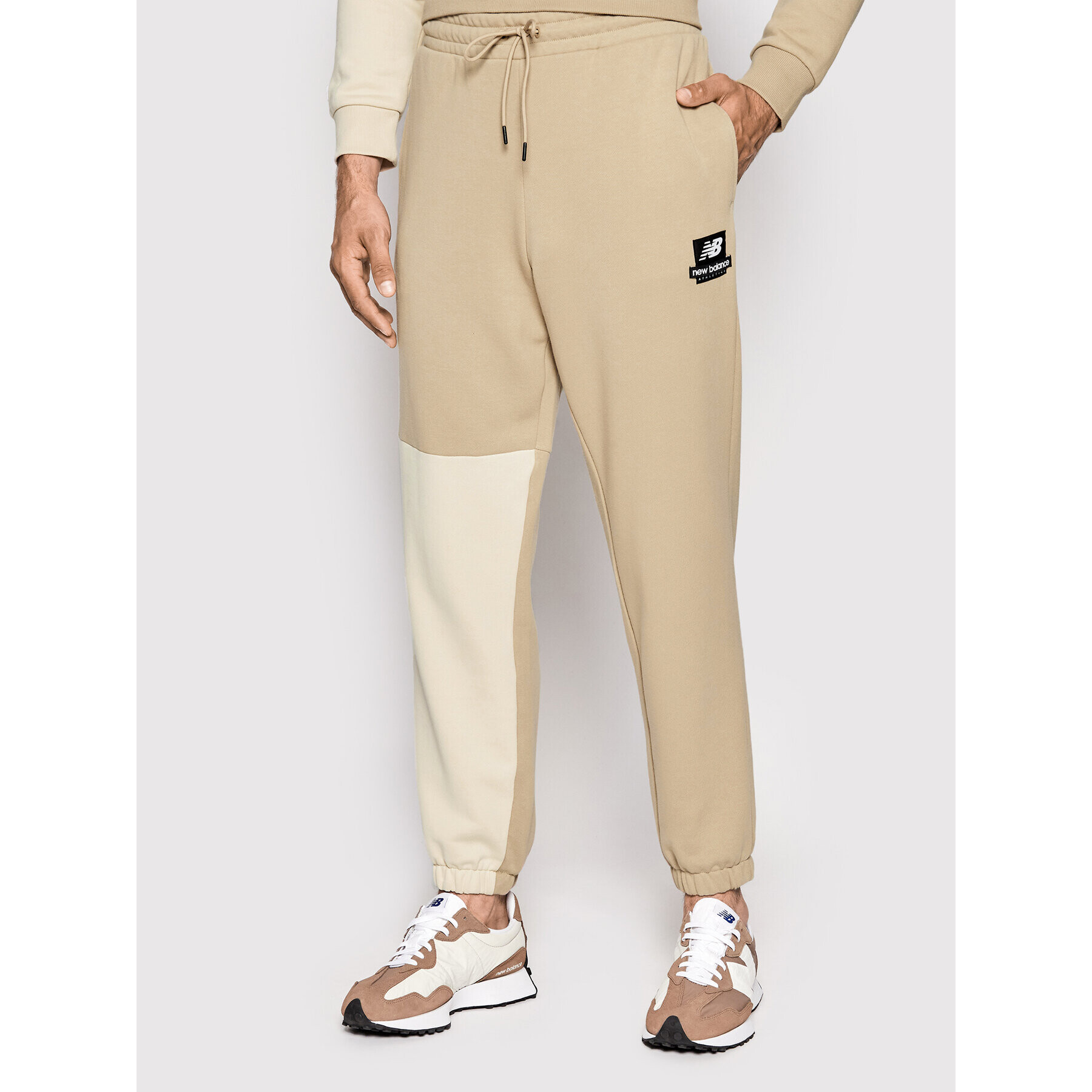 New Balance Pantaloni trening MP21550 Bej Regular Fit - Pled.ro