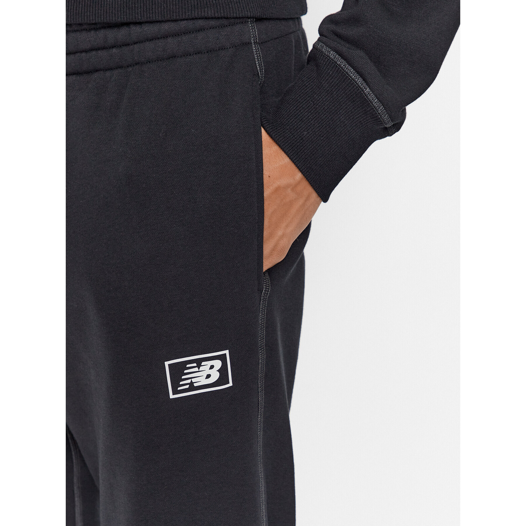 New Balance Pantaloni trening NB Essentials Sweatpant MP33509 Negru Regular Fit - Pled.ro