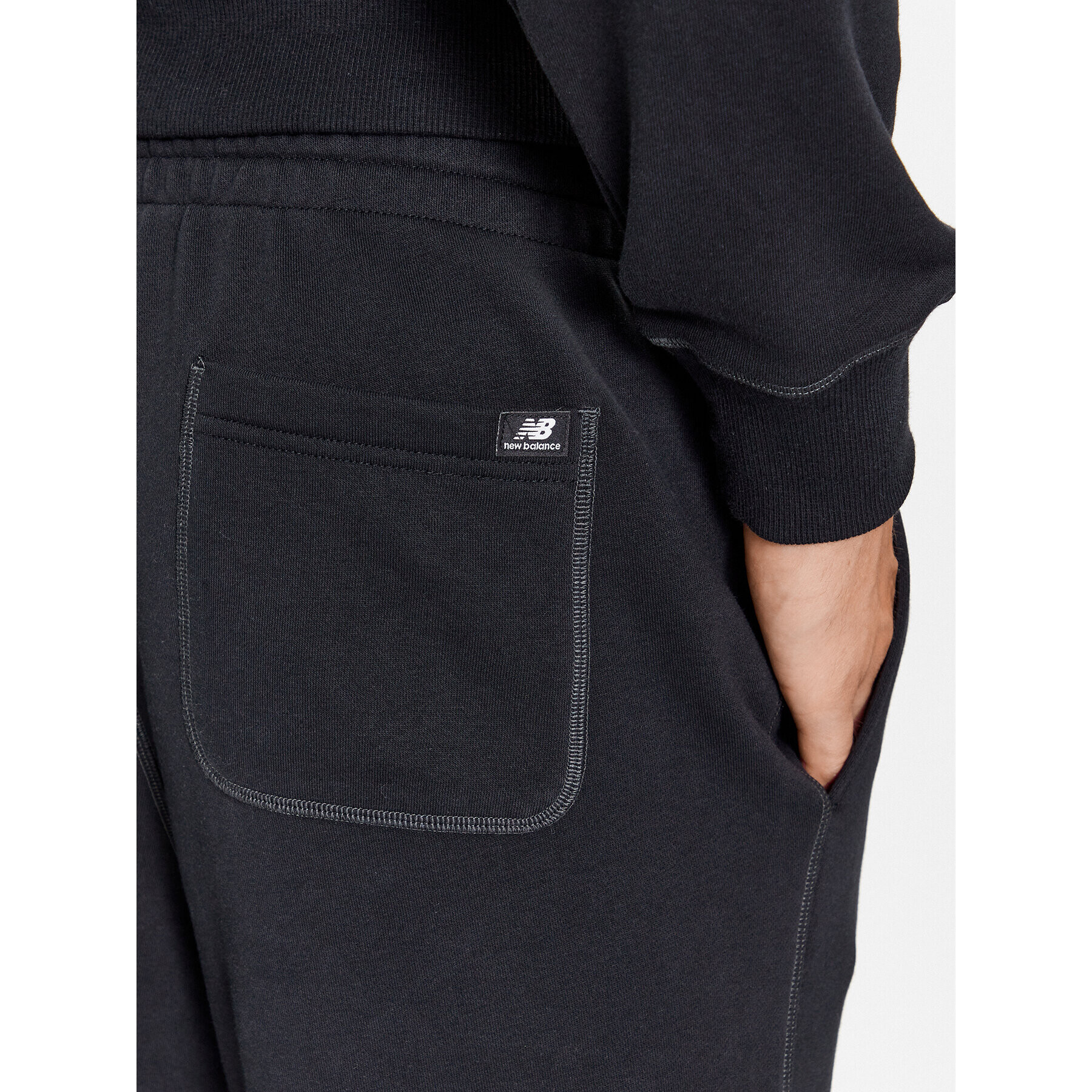 New Balance Pantaloni trening NB Essentials Sweatpant MP33509 Negru Regular Fit - Pled.ro