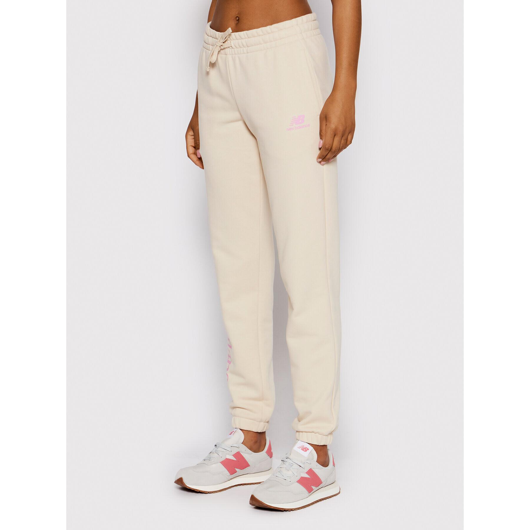 New Balance Pantaloni trening WP21508 Bej Regular Fit - Pled.ro