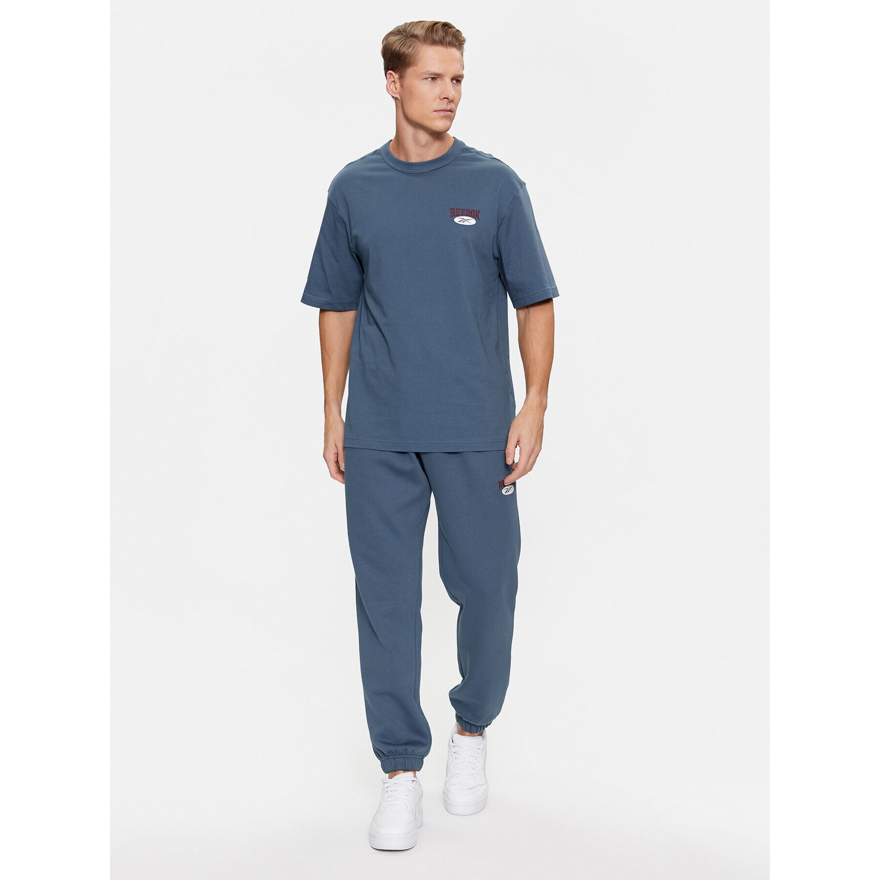 Reebok Pantaloni trening Archive Essentials IM1526 Albastru Regular Fit - Pled.ro