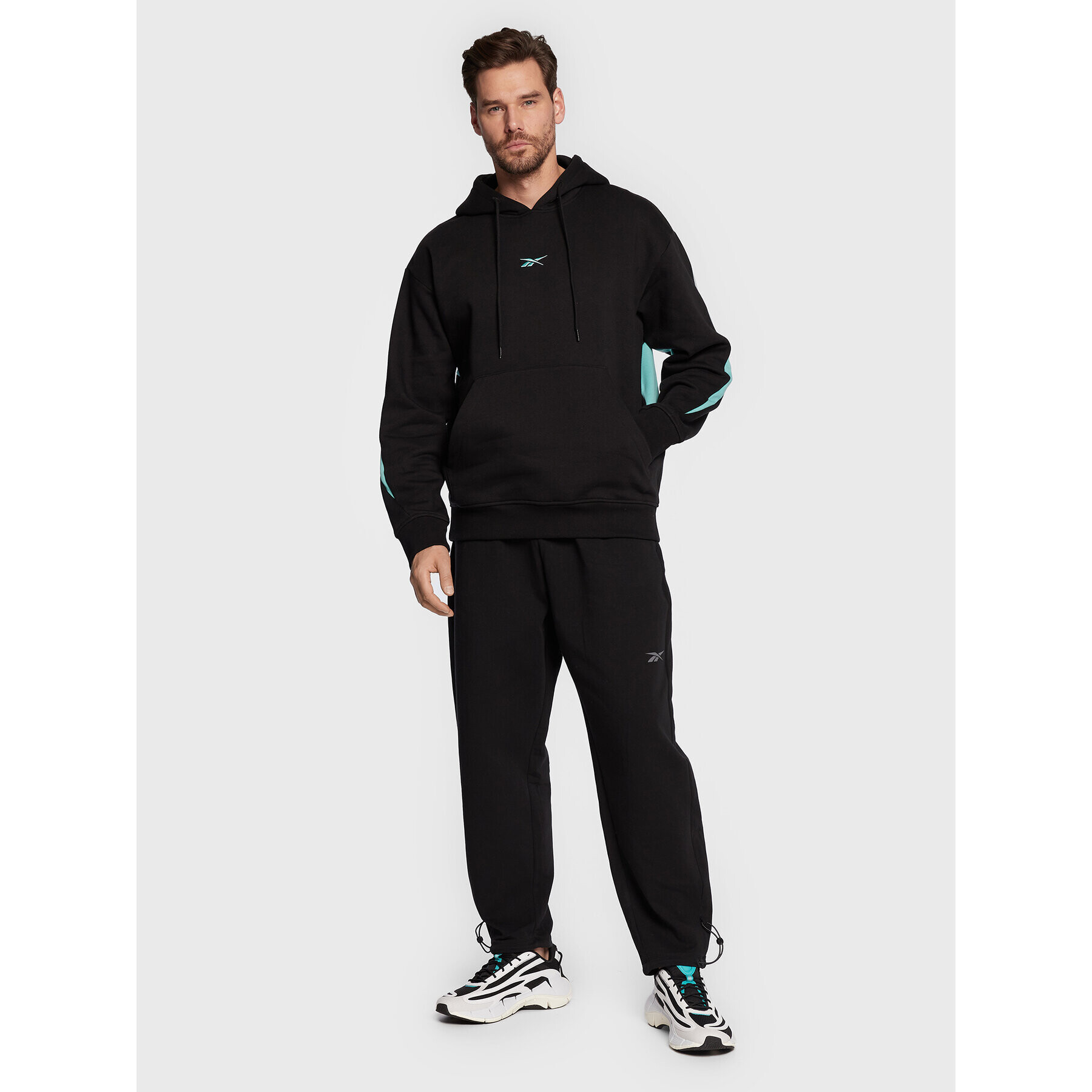 Reebok Pantaloni trening DreamBlend HG8906 Negru Loose Fit - Pled.ro