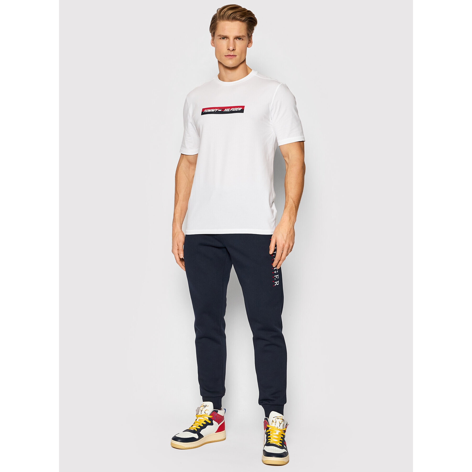 Tommy Hilfiger Pantaloni trening Corp Graphic MW0MW22205 Bleumarin Regular Fit - Pled.ro