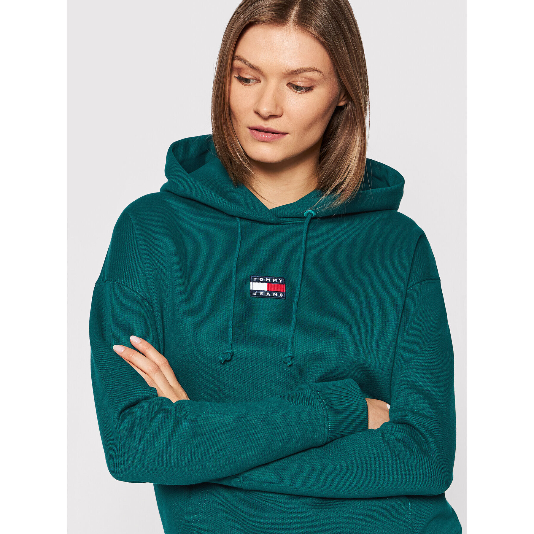 Tommy Jeans Bluză Center Badge DW0DW10403 Verde Relaxed Fit - Pled.ro