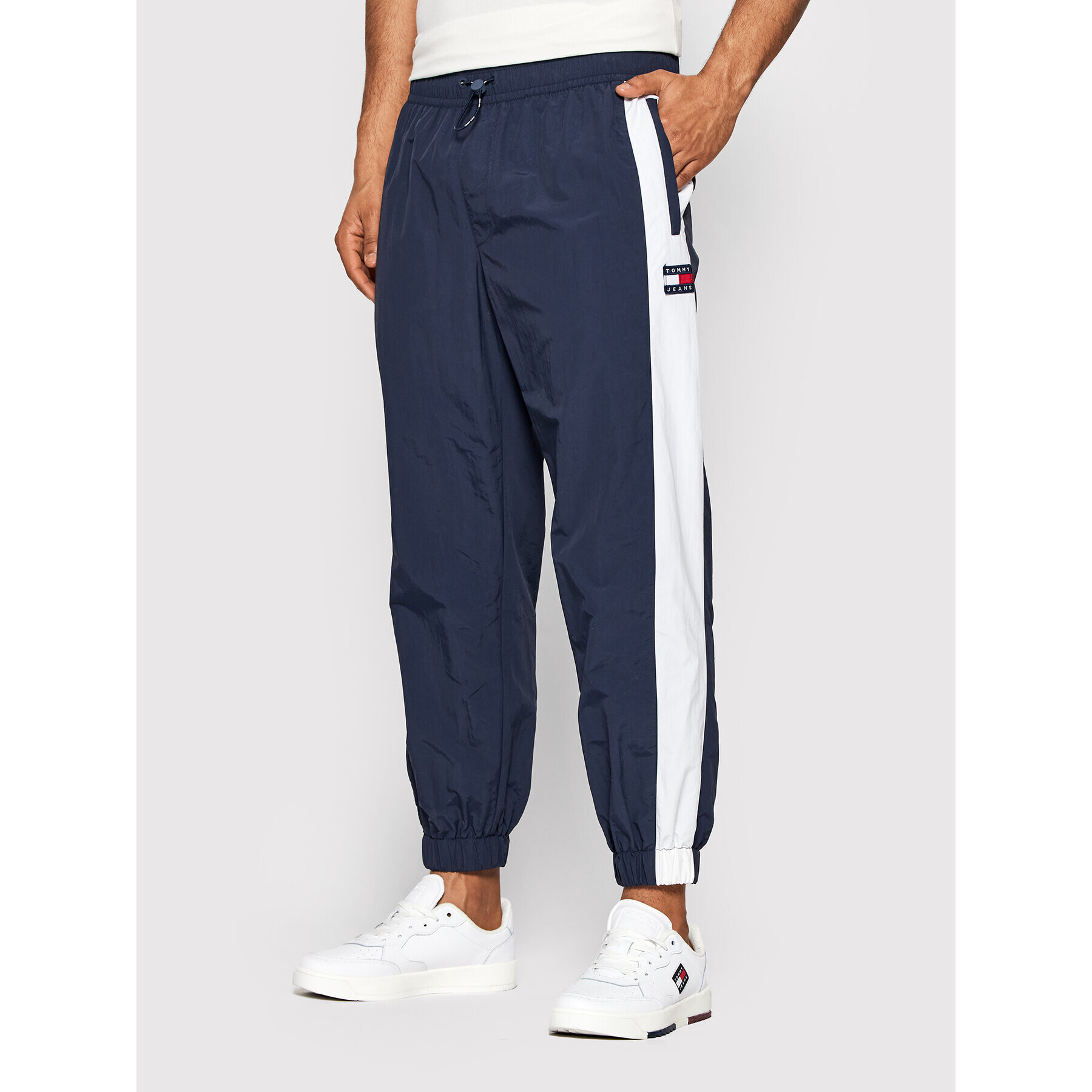 Tommy Jeans Pantaloni trening Archive Windpant DM0DM12761 Bleumarin Relaxed Fit - Pled.ro