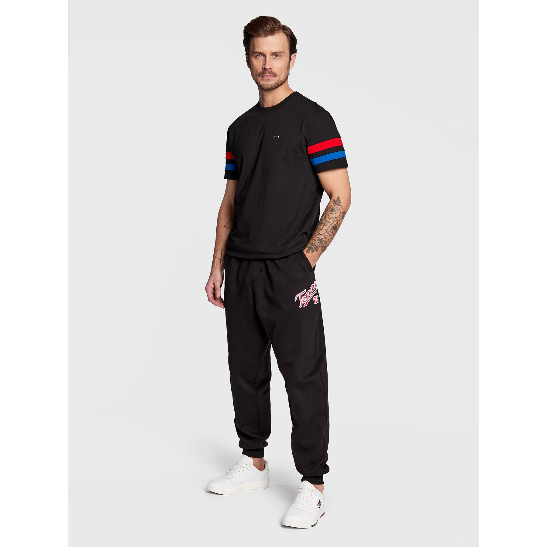 Tommy Jeans Pantaloni trening College DM0DM15807 Negru Relaxed Fit - Pled.ro