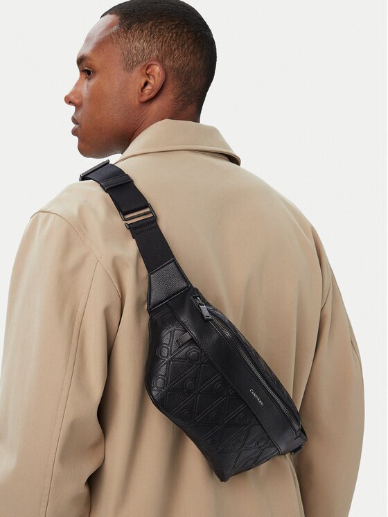 Calvin Klein Borsetă Emblem Aop Deboss Waistbag LV04D3564G