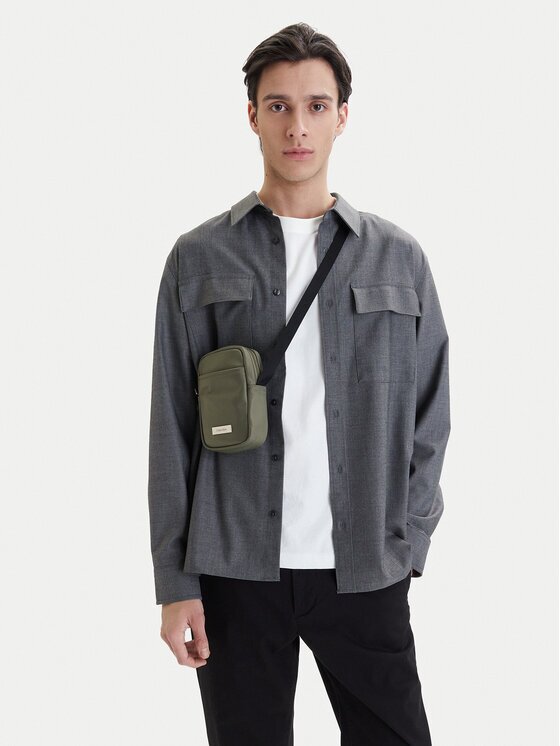 Calvin Klein Geantă crossover Sleek Slim Reporter LV04D3233G