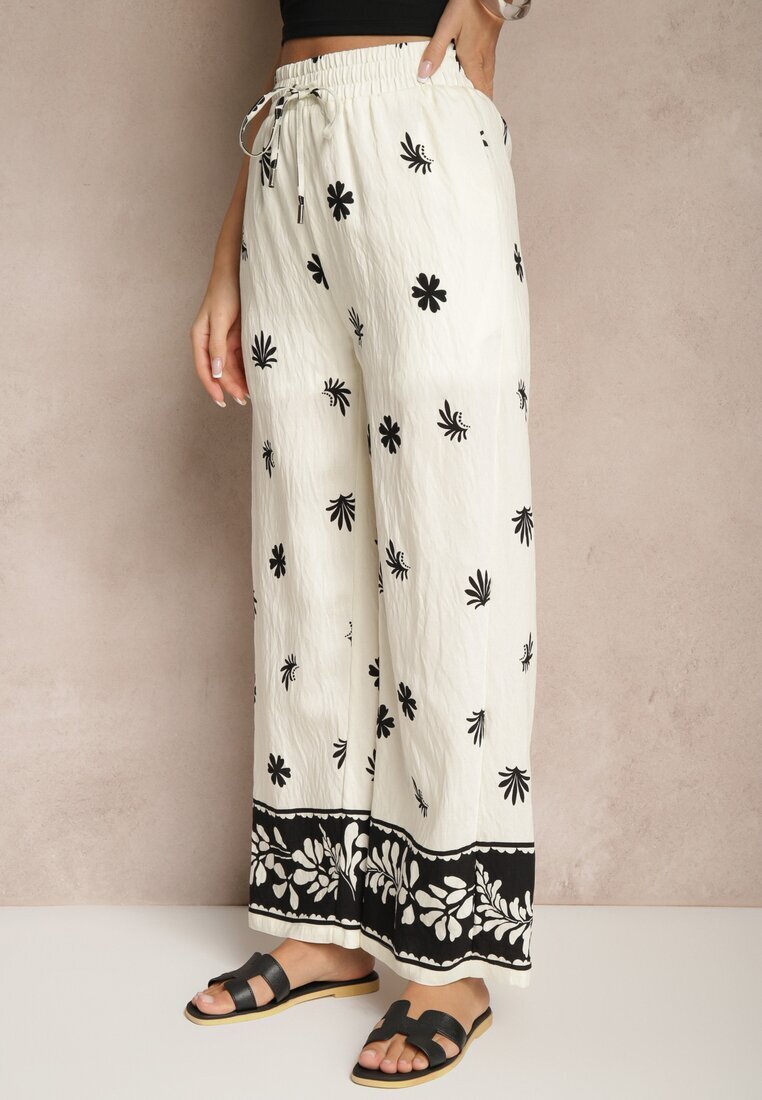 sophyline paris Pantaloni Bej deschis din viscoză cu croială largă cu elastic în talie cu imprimeu floral Nimilassa