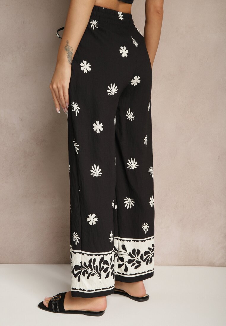 sophyline paris Pantaloni negri din vâscoză cu croială largă cu elastic în talie cu imprimeu floral Nimilassa