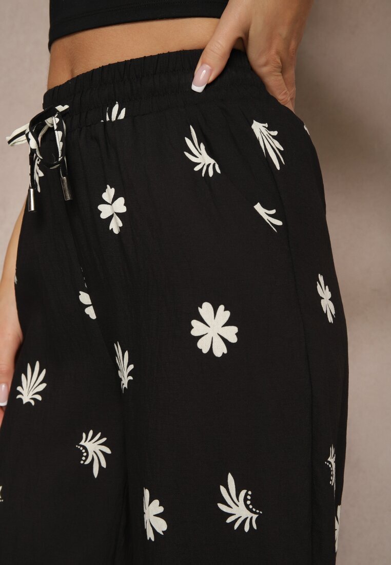 sophyline paris Pantaloni negri din vâscoză cu croială largă cu elastic în talie cu imprimeu floral Nimilassa